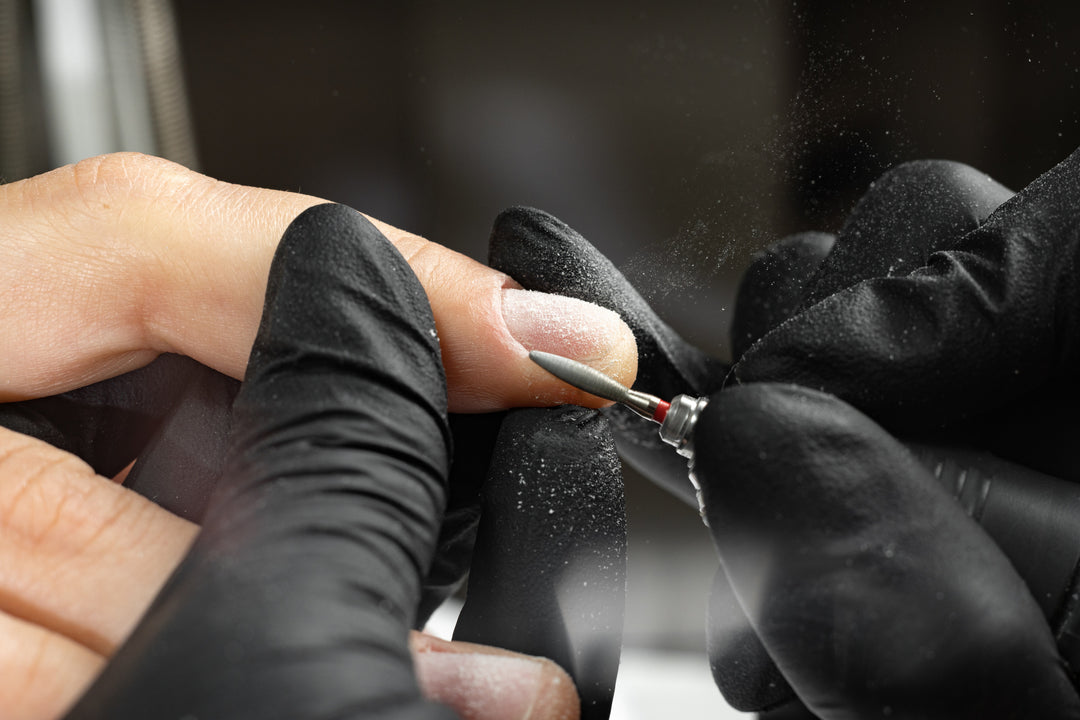 Nail file being used by a nail professional during a manicure